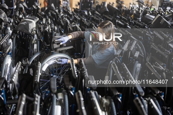 Workers rush to make Japanese-ordered products on the wheelchair production line of Zhongjin Medical Equipment Taizhou Co., Ltd. in Taizhou,...