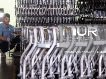 Workers rush to make Japanese-ordered products on the wheelchair production line of Zhongjin Medical Equipment Taizhou Co., Ltd. in Taizhou,...