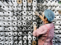 A worker works on the production line of a woven bag company in Lianyungang, China, on October 8, 2024. (