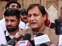 Javid Ahmad Dar, the National Conference Candidate for the Rafiabad Assembly Constituency, speaks to the media during election results in Ba...