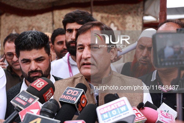 Javid Ahmad Dar, the National Conference Candidate for the Rafiabad Assembly Constituency, speaks to the media during election results in Ba...