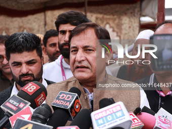 Javid Ahmad Dar, the National Conference Candidate for the Rafiabad Assembly Constituency, speaks to the media during election results in Ba...