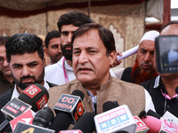 Javid Ahmad Dar, the National Conference Candidate for the Rafiabad Assembly Constituency, speaks to the media during election results in Ba...