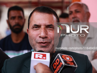 Pirzada Farooq Ahmed Shah, the National Conference candidate for the Gulmarg Assembly Constituency, speaks to the media during the results i...