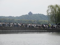 Crowds of people gather at West Lake during the National Day holiday in Hangzhou, China, on October 2, 2024. On October 8, 2024, according t...