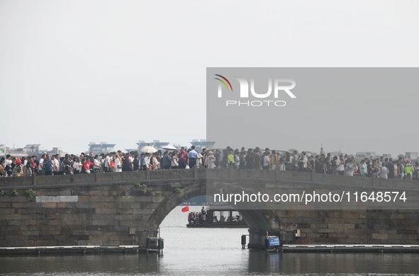 Crowds of people gather at West Lake during the National Day holiday in Hangzhou, China, on October 2, 2024. On October 8, 2024, according t...