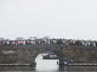 Crowds of people gather at West Lake during the National Day holiday in Hangzhou, China, on October 2, 2024. On October 8, 2024, according t...