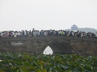 Crowds of people gather at West Lake during the National Day holiday in Hangzhou, China, on October 2, 2024. On October 8, 2024, according t...