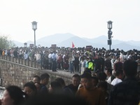 Crowds of people gather at West Lake during the National Day holiday in Hangzhou, China, on October 2, 2024. On October 8, 2024, according t...