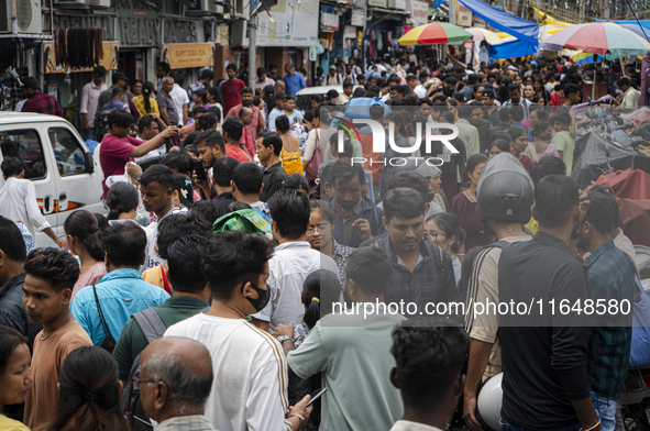 A crowd of people shops at a street market ahead of the Durga Puja festival in Guwahati, India, on October 7, 2024. Shopping ahead of Durga...