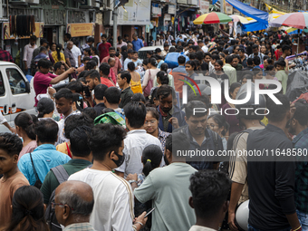 A crowd of people shops at a street market ahead of the Durga Puja festival in Guwahati, India, on October 7, 2024. Shopping ahead of Durga...