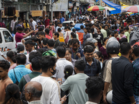 A crowd of people shops at a street market ahead of the Durga Puja festival in Guwahati, India, on October 7, 2024. Shopping ahead of Durga...