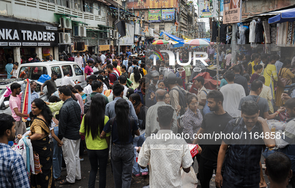 A crowd of people shops at a street market ahead of the Durga Puja festival in Guwahati, India, on October 7, 2024. Shopping ahead of Durga...