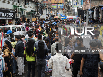 A crowd of people shops at a street market ahead of the Durga Puja festival in Guwahati, India, on October 7, 2024. Shopping ahead of Durga...