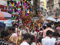 A vendor sells toys and other children's items at a street market ahead of the Durga Puja festival in Guwahati, India, on October 7, 2024. S...