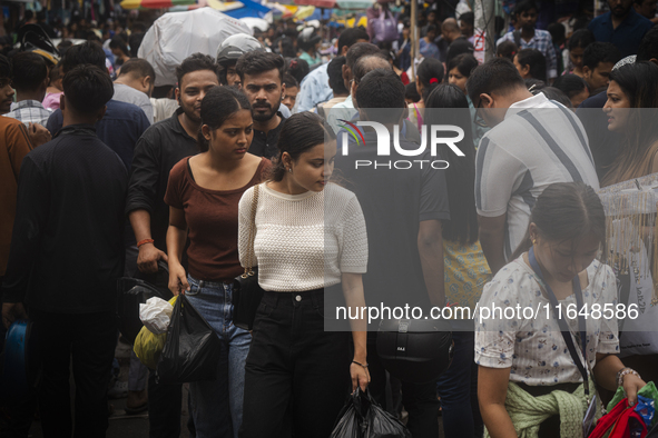 A crowd of people shops at a street market ahead of the Durga Puja festival in Guwahati, India, on October 7, 2024. Shopping ahead of Durga...