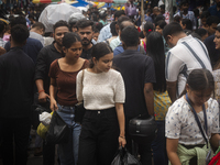 A crowd of people shops at a street market ahead of the Durga Puja festival in Guwahati, India, on October 7, 2024. Shopping ahead of Durga...