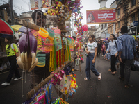 A vendor sells toys and other children's items at a street market ahead of the Durga Puja festival in Guwahati, India, on October 7, 2024. S...