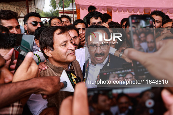 Sajad Shafi, the National Conference winning candidate from Audi, speaks to the media outside the counting center during assembly election r...