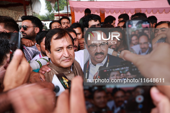 Sajad Shafi, the National Conference winning candidate from Audi, speaks to the media outside the counting center during assembly election r...