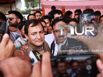 Sajad Shafi, the National Conference winning candidate from Audi, speaks to the media outside the counting center during assembly election r...