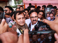 Sajad Shafi, the National Conference winning candidate from Audi, speaks to the media outside the counting center during assembly election r...