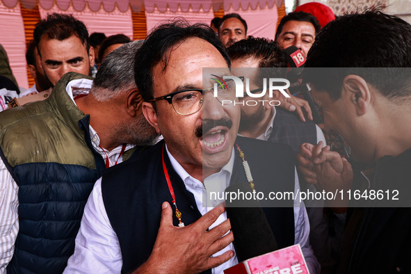 Sajad Shafi, the National Conference winning candidate from Audi, speaks to the media outside the counting center during assembly election r...