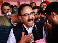 Sajad Shafi, the National Conference winning candidate from Audi, speaks to the media outside the counting center during assembly election r...