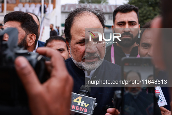 Javid Hassan Baig, the National Conference winning candidate from Baramulla, speaks to the media outside the counting center during assembly...