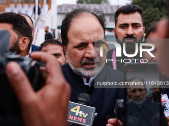 Javid Hassan Baig, the National Conference winning candidate from Baramulla, speaks to the media outside the counting center during assembly...