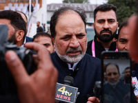 Javid Hassan Baig, the National Conference winning candidate from Baramulla, speaks to the media outside the counting center during assembly...