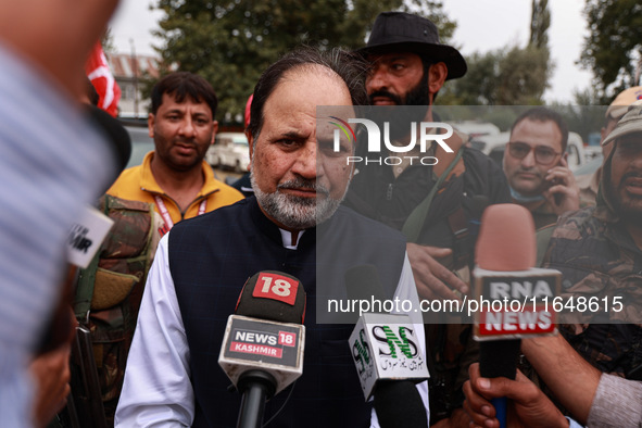 Javid Hassan Baig, the National Conference winning candidate from Baramulla, speaks to the media outside the counting center during assembly...