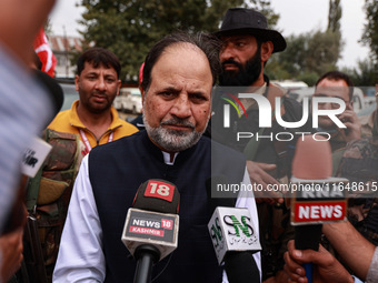 Javid Hassan Baig, the National Conference winning candidate from Baramulla, speaks to the media outside the counting center during assembly...