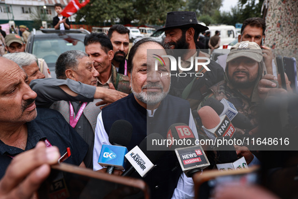 Javid Hassan Baig, the National Conference winning candidate from Baramulla, speaks to the media outside the counting center during assembly...