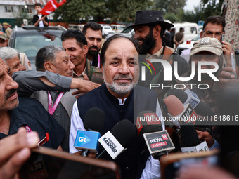 Javid Hassan Baig, the National Conference winning candidate from Baramulla, speaks to the media outside the counting center during assembly...