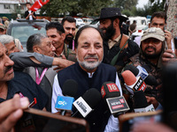 Javid Hassan Baig, the National Conference winning candidate from Baramulla, speaks to the media outside the counting center during assembly...