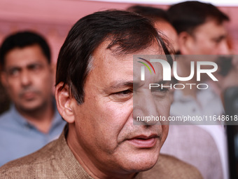 Javid Ahmad Dar, the National Conference winning candidate from Rafiabad, speaks to the media outside the counting center during assembly el...