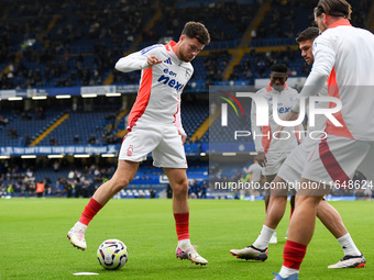 Neco Williams of Nottingham Forest warms up ahead of kick-off during the Premier League match between Chelsea and Nottingham Forest at Stamf...