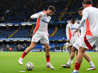 Neco Williams of Nottingham Forest warms up ahead of kick-off during the Premier League match between Chelsea and Nottingham Forest at Stamf...