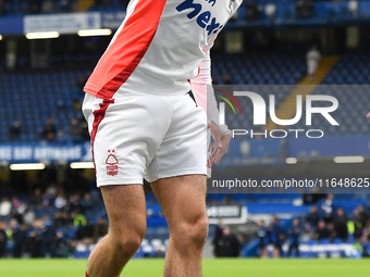 Neco Williams of Nottingham Forest warms up ahead of kick-off during the Premier League match between Chelsea and Nottingham Forest at Stamf...