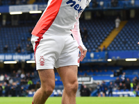 Neco Williams of Nottingham Forest warms up ahead of kick-off during the Premier League match between Chelsea and Nottingham Forest at Stamf...