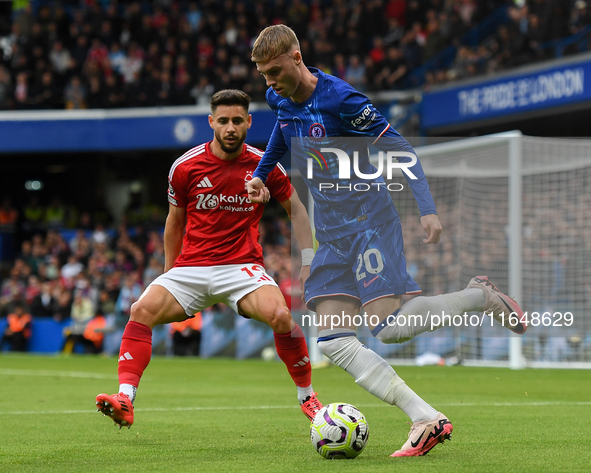 Cole Palmer of Chelsea is under pressure from Alex Moreno of Nottingham Forest during the Premier League match between Chelsea and Nottingha...