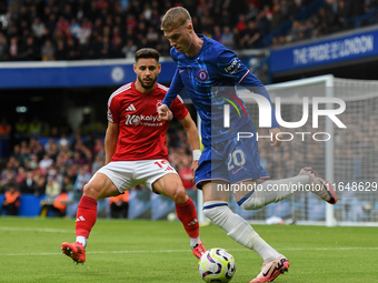 Cole Palmer of Chelsea is under pressure from Alex Moreno of Nottingham Forest during the Premier League match between Chelsea and Nottingha...