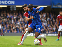 Alex Moreno of Nottingham Forest battles with Noni Madueke of Chelsea during the Premier League match between Chelsea and Nottingham Forest...