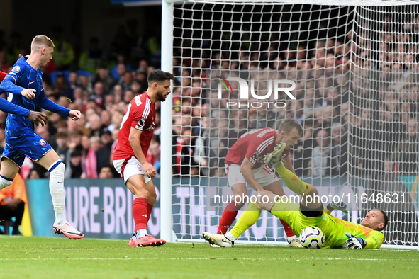 Matz Sels, the Nottingham Forest goalkeeper, saves the ball with James Ward-Prowse and Alex Moreno of Nottingham Forest supporting as Cole P...