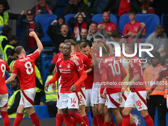 The Reds celebrate after Chris Wood of Nottingham Forest scores a goal to make it 0-1 during the Premier League match between Chelsea and No...