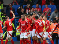 The Reds celebrate after Chris Wood of Nottingham Forest scores a goal to make it 0-1 during the Premier League match between Chelsea and No...