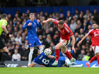 Elliott Anderson of Nottingham Forest battles with Enzo Fernandez of Chelsea during the Premier League match between Chelsea and Nottingham...