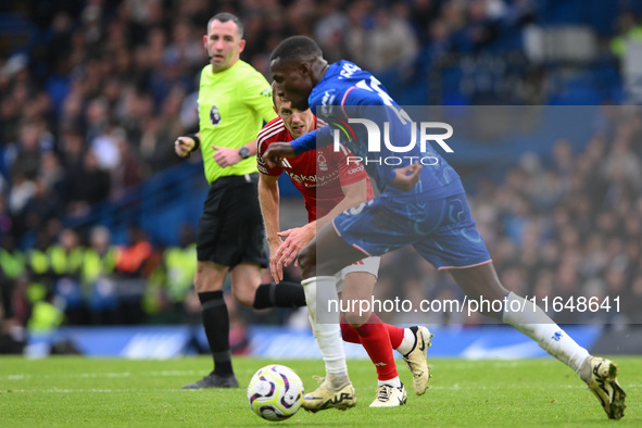 James Ward-Prowse of Nottingham Forest puts pressure on Nicolas Jackson of Chelsea during the Premier League match between Chelsea and Notti...