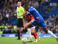 James Ward-Prowse of Nottingham Forest puts pressure on Nicolas Jackson of Chelsea during the Premier League match between Chelsea and Notti...